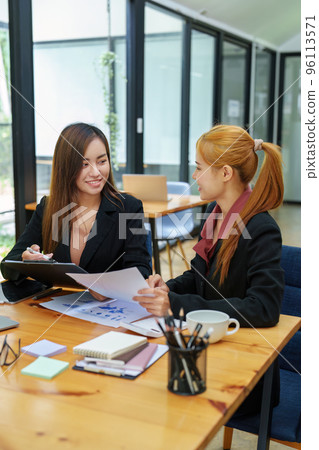 Portrait of an Asian businesswoman consulting, start up a marketing plan to meet the needs of customers in office room Portrait of an Asian businesswoman consulting, start up a marketing plan to meet the needs of customers in office room 96113571