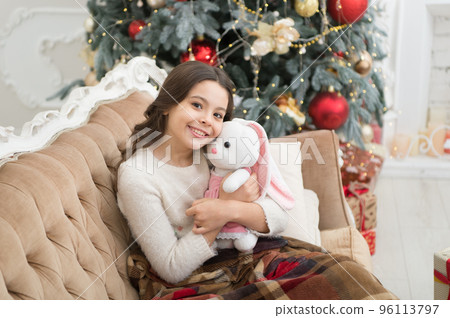 Best holiday. ready for xmas presents. small girl love her bunny. best christmas toy. cheerful kid play toy at christmas tree. feeling cosy at home. happy new year mood. happiness and joy Best holiday. ready for xmas presents. small girl love her bunny. best christmas toy. cheerful kid play toy at christmas tree. feeling cosy at home. happy new year mood. happiness and joy 96113797