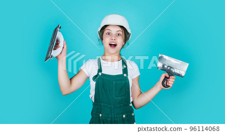 happy kid engineer with plastering tool spatula in hard hat, development happy kid engineer with plastering tool spatula in hard hat, development 96114068