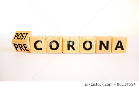 Covid-19 post or pre corona symbol. Turned wooden cubes and changed concept words Pre corona to Post corona. Beautiful white background. Covid-19 pandemic post or pre corona concept. Copy space. Covid-19 post or pre corona symbol. Turned wooden cubes and changed concept words Pre corona to Post corona. Beautiful white background. Covid-19 pandemic post or pre corona concept. Copy space. 96114554
