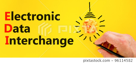 EDI electronic data interchange symbol. Concept words EDI electronic data interchange on a beautiful yellow background. Light bulb. Business and EDI electronic data interchange concept. Copy space. EDI electronic data interchange symbol. Concept words EDI electronic data interchange on a beautiful yellow background. Light bulb. Business and EDI electronic data interchange concept. Copy space. 96114582