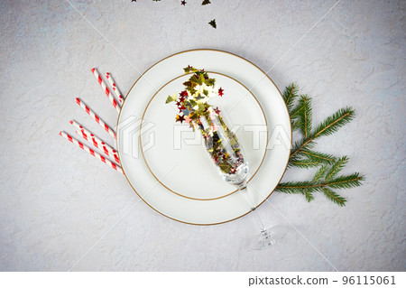 Empty Plate with Christmas decorations and fir tree on wooden background, flat lay. 96115061