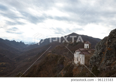 monastery on cliff, holy place in mountains, autumn landscape, old Orthodox church 96115583