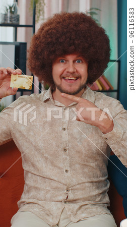 Man showing credit bank card advertising transferring money cashless, purchases online shopping Man showing credit bank card advertising transferring money cashless, purchases online shopping 96116583