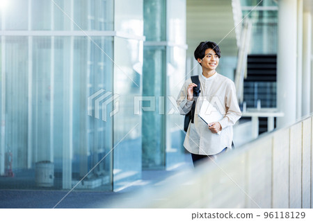 College student walking on campus 96118129