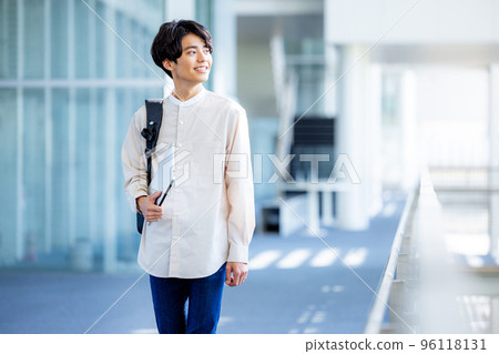 College student walking on campus College student walking on campus 96118131