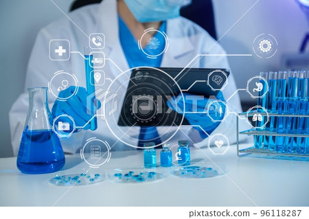 Healthcare professional holding Coronavirus COVID-19 vaccine in laboratory study and analyze scientific sample of Coronavirus antibody.. Healthcare professional holding Coronavirus COVID-19 vaccine in laboratory study and analyze scientific sample of Coronavirus antibody.. 96118287
