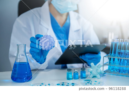 Coronavirus COVID-19 medical test vaccine research and development concept.in the chemistry lab. . Coronavirus COVID-19 medical test vaccine research and development concept.in the chemistry lab. . 96118288