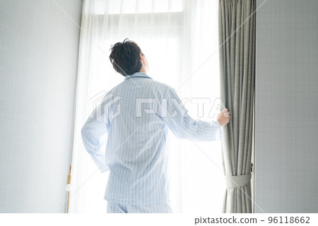 A man in his 40s in the bedroom A man in his 40s in the bedroom 96118662