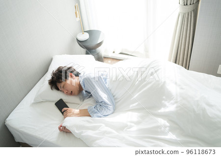 A man in his 40s in the bedroom 96118673