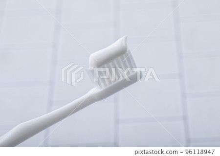 Toothbrush placed on tiles 96118947