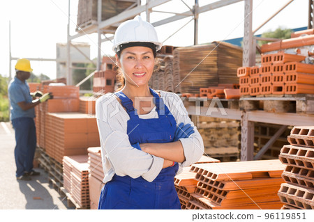 Asian woman in outdoor storage Asian woman in outdoor storage 96119851