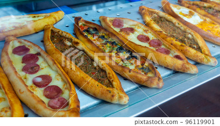 Assorted Turkish foodset. Pide with meat, pide with cheese, pide mix Assorted Turkish foodset. Pide with meat, pide with cheese, pide mix 96119901