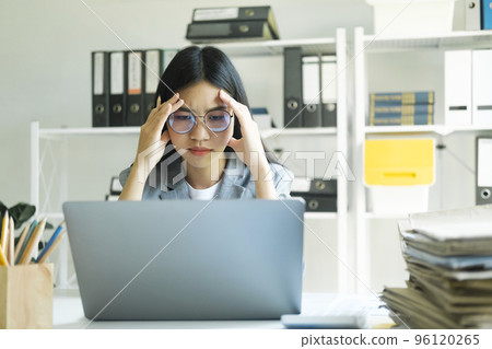 Stressed overwork businesswoman in the office. Stressed overwork businesswoman in the office. 96120265