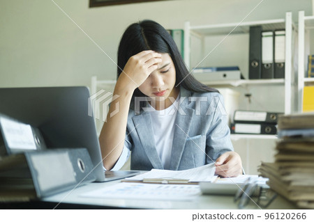 Stressed overwork businesswoman in the office. Stressed overwork businesswoman in the office. 96120266