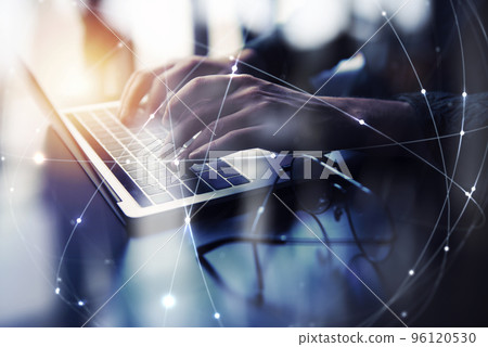 Business man works in office with laptop. Concept of internet network. double exposure 96120530