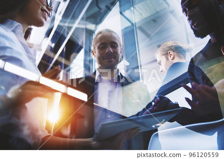 Business people connected on internet network with a tablet. concept of startup company. Double exposure Business people connected on internet network with a tablet. concept of startup company. Double exposure 96120559