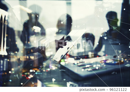 Businesswoman works in office with a tablet. Concept of internet sharing and company startup. double exposure Businesswoman works in office with a tablet. Concept of internet sharing and company startup. double exposure 96121122