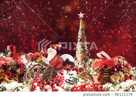 Christmas background concept. Shimmering Christmas decorations with tree, Santa Claus and candles Christmas background concept. Shimmering Christmas decorations with tree, Santa Claus and candles 96121176