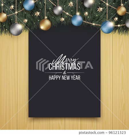 A chic Christmas tree and a plain black board on a wooden wall 96121323