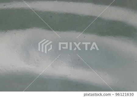 Macro shot of white antique ceramic surface with wavy pattern. 96121630