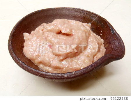 A small bowl of whipped sauce made with fresh filefish liver. 96122388