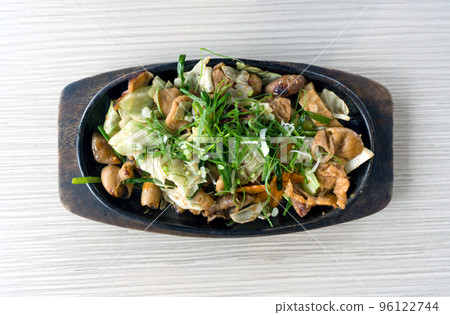 Horumon Sutamina Itame, vegetable stir fry with pork innards served on hot pan. Top View 96122744