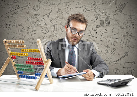 Nerd accountant does calculation of company revenue 96122881