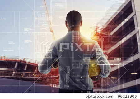 Businessman Architect analyzes the works of a building. double exposure Businessman Architect analyzes the works of a building. double exposure 96122909