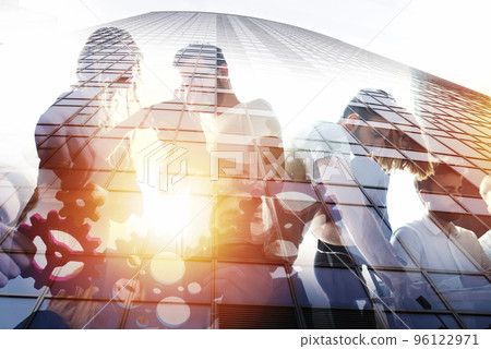 Business people work together in office. Concept of teamwork and partnership. double exposure Business people work together in office. Concept of teamwork and partnership. double exposure 96122971