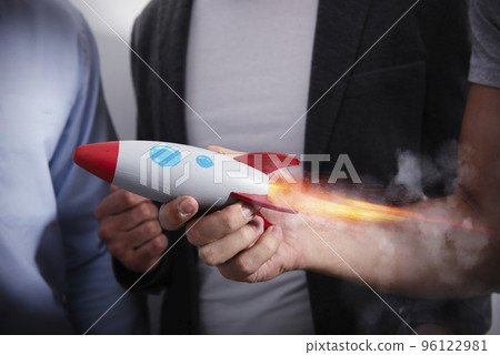Businessman launches his startup company with a rocket Businessman launches his startup company with a rocket 96122981