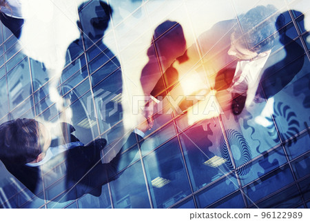 Handshaking business person in office. concept of teamwork and partnership. double exposure with gears system and network effects 96122989