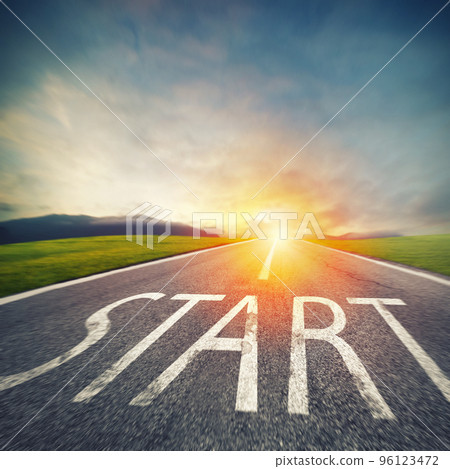Start written to the ground on a road at sunset. Concept of new beginning and starting new opportunities 96123472