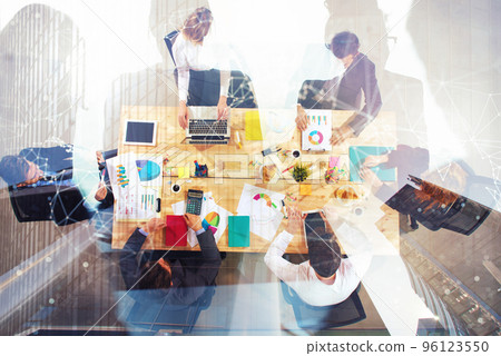 Business people work together in office. Concept of teamwork and partnership. double exposure Business people work together in office. Concept of teamwork and partnership. double exposure 96123550
