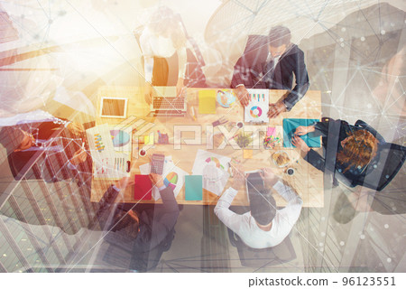 Business people work together in office. Concept of teamwork and partnership. double exposure Business people work together in office. Concept of teamwork and partnership. double exposure 96123551