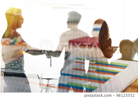 Silhouette of young workers shaking hands in the office. concept of teamwork and partnership. double exposure Silhouette of young workers shaking hands in the office. concept of teamwork and partnership. double exposure 96123552