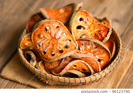 Dried bael slices on basket background, Bael for bael juice - Dry bael fruit tea for health - Aegle marmelos 96123790
