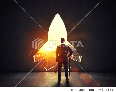 Concept of startup with a rocket shape hole in the wall which alludes to the departure towards new goals Concept of startup with a rocket shape hole in the wall which alludes to the departure towards new goals 96124133