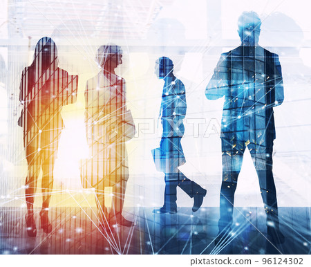 Business people work together in office with internet network effects. Concept of teamwork and partnership. double exposure 96124302