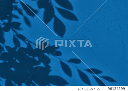 Shadow of leaves on blue concrete wall texture background Shadow of leaves on blue concrete wall texture background 96124699