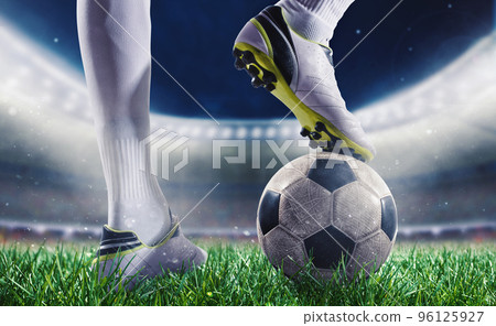 Soccer player with soccerball at the stadium ready for the match 96125927