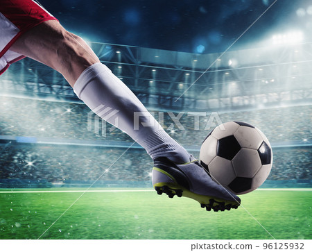 Soccer player with soccerball at the stadium ready for the match Soccer player with soccerball at the stadium ready for the match 96125932