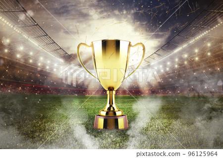 Golden winner's cup in the middle of a stadium with audience 96125964