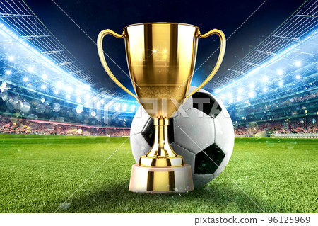 Golden winner s cup in the middle of a soccer stadium with audience Golden winner s cup in the middle of a soccer stadium with audience 96125969