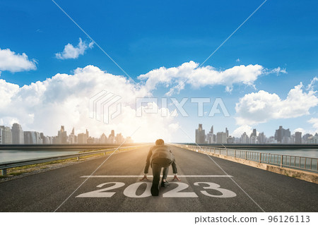 Businessman looking the City skyline with skyscrapers in the background. 2023 year goals concept. 96126113