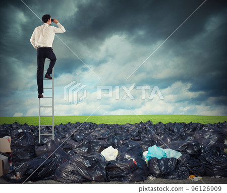 Businessman on a stairs searches far for clean environment. overcome the global pollution problem Businessman on a stairs searches far for clean environment. overcome the global pollution problem 96126909