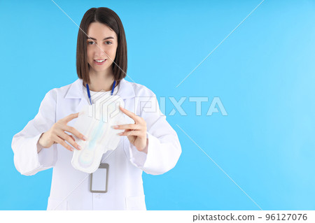 Concept of profession, young female doctor on blue background 96127076