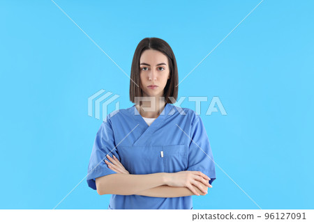Concept of profession, young female doctor on blue background 96127091