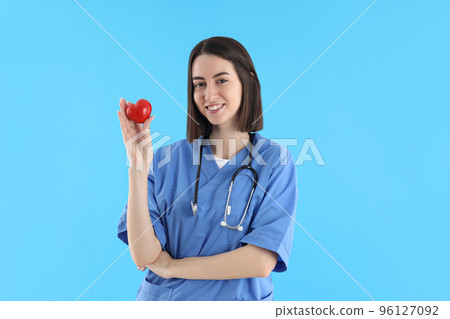 Concept of profession, young female doctor on blue background 96127092
