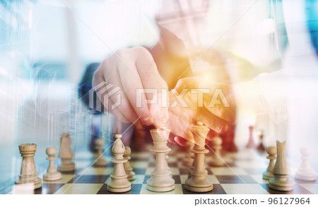 Business strategy with chess game and handshaking business person in office. concept of challenge and tactic. double exposure 96127964